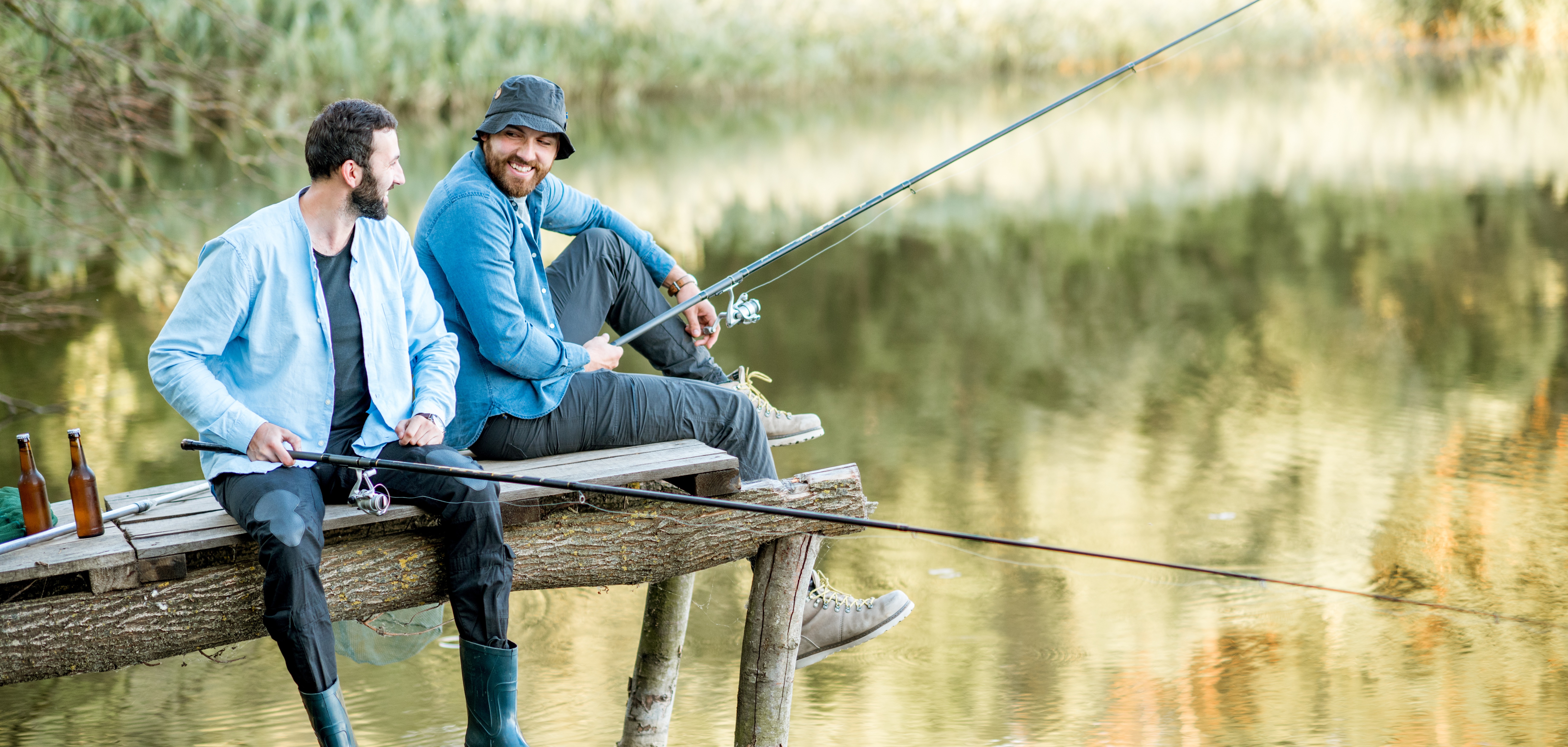 Friends fishing on a rustic dock, enjoying natures beauty and outdoor relaxation by the lake.