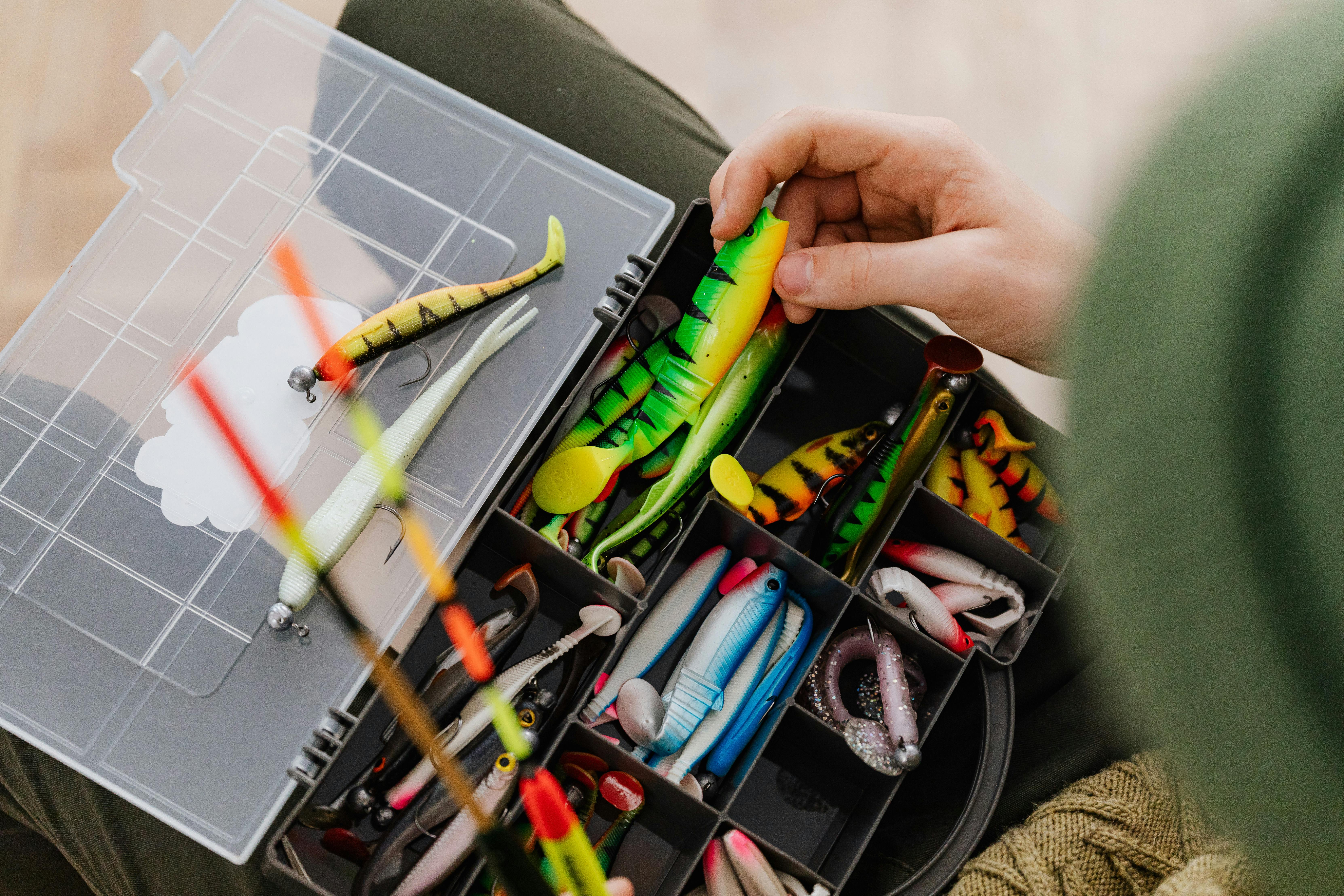 Colorful fishing lures in a tackle box ready for an exciting fishing trip.