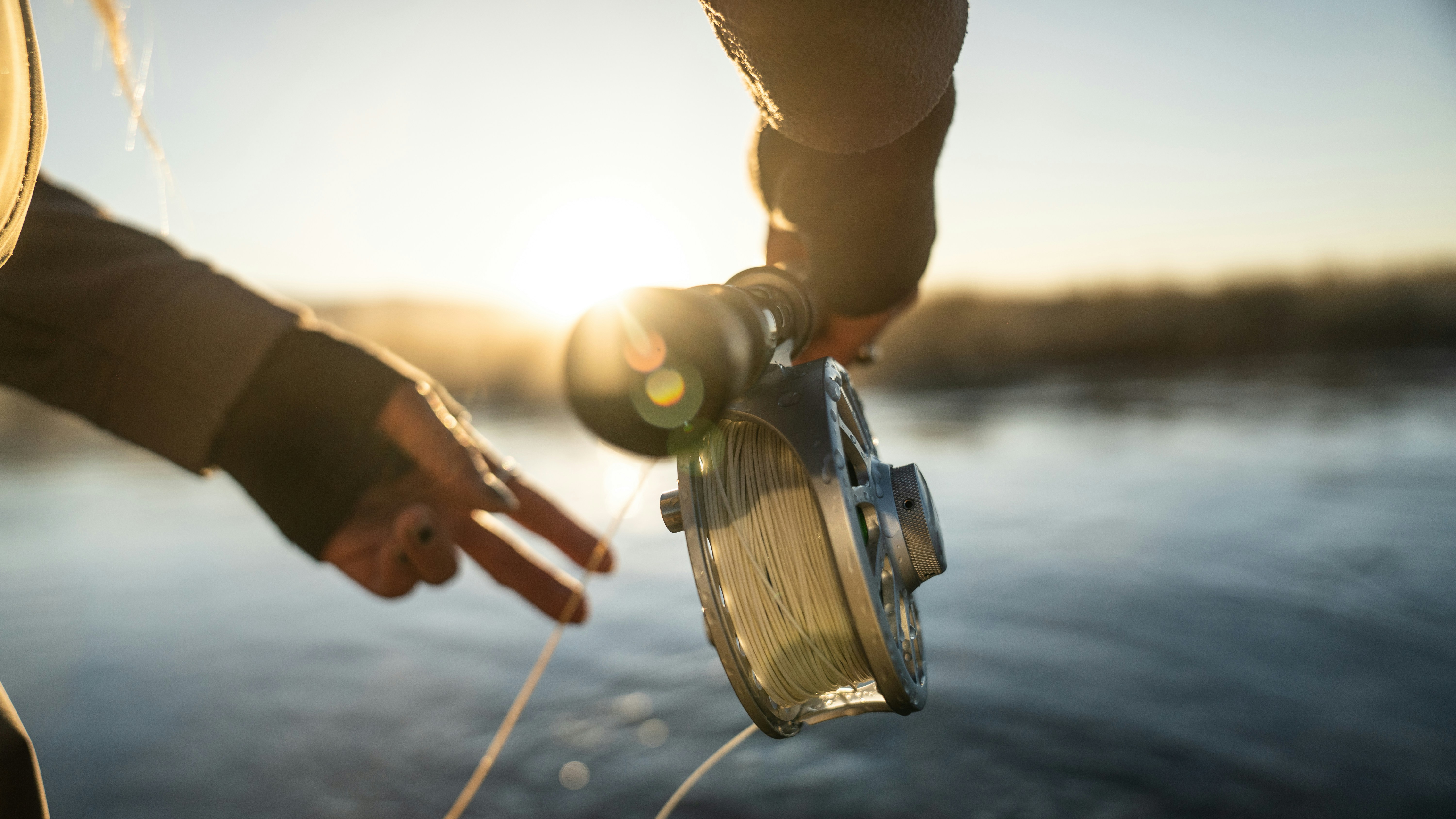 Experience peaceful fly fishing, showcasing skill and natures beauty with quality gear in action.